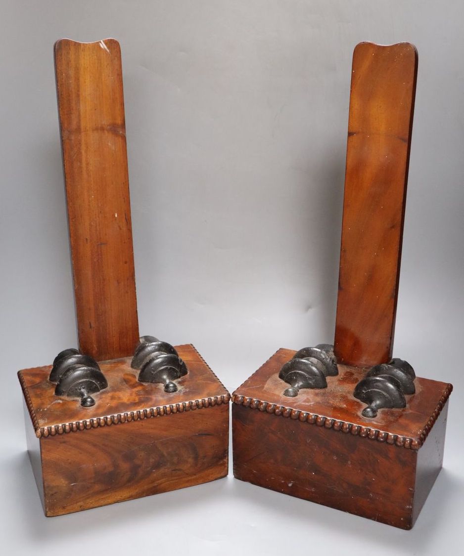 A pair of 19th century mahogany veneered plate stands stamped Gillows, 48cm high